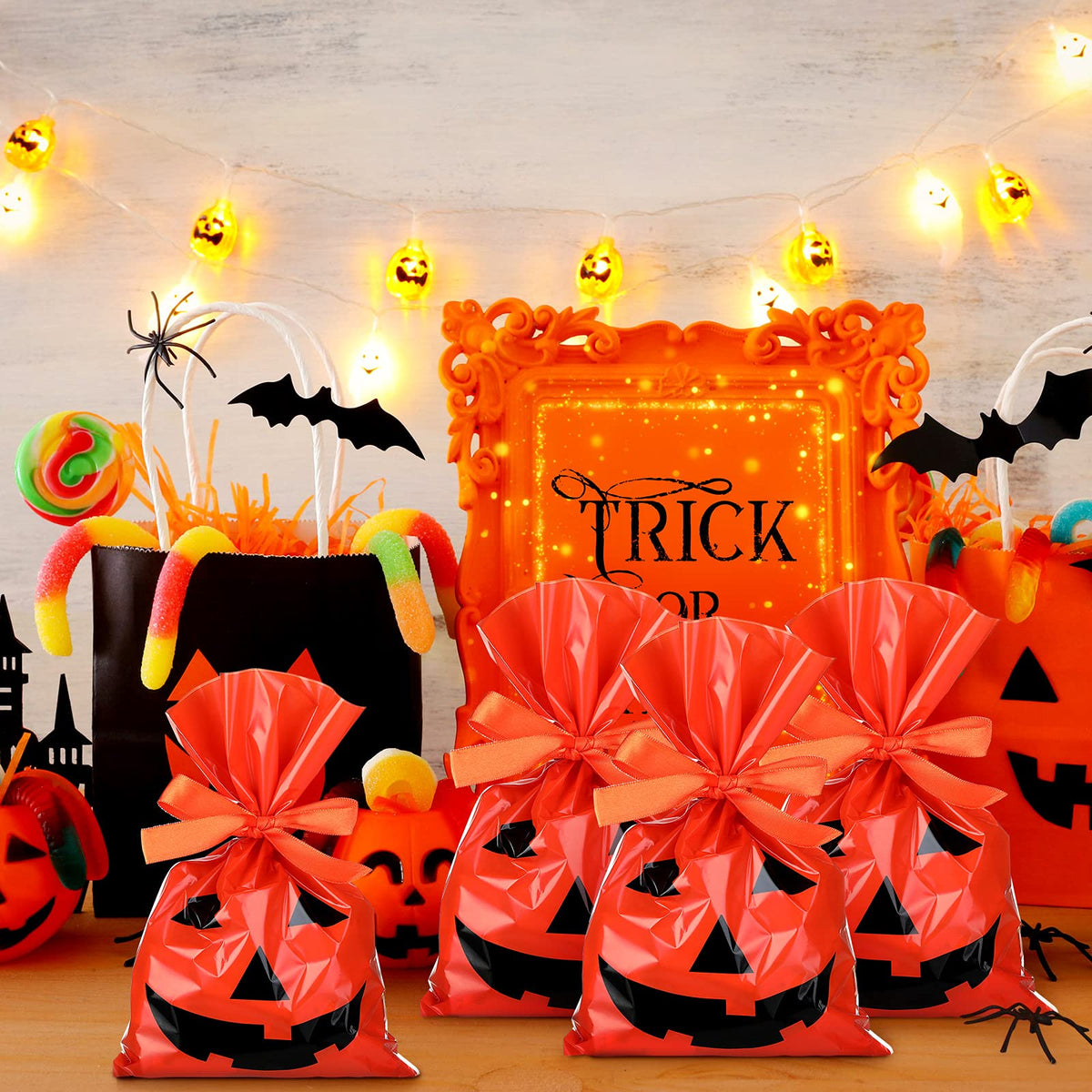 Tenare 100 Pcs Halloween Cellophane Pumpkin Treat Bags Jack O Lantern Orange Candy Bags Plastic Pumpkin Smile Goodies Gift Decor with Gold Twist Ties for Dessert Halloween Party Favors, 6 x 9 Inch
