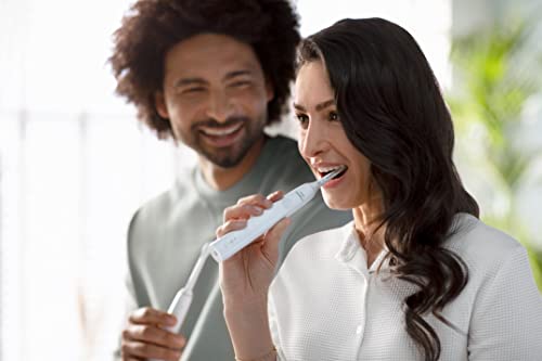 Philips Sonicare 4100 Rechargeable Electric Toothbrush, with Pressure Sensor, 2 Intensity Settings, SmarTimer and QuadPacer, 14-Day Battery Life, Deep Pink, Model HX3681/26