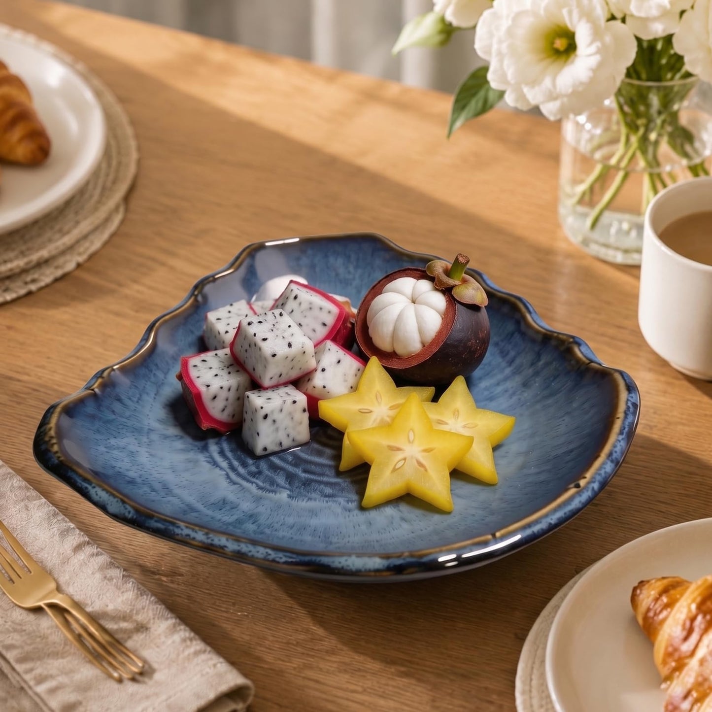 Konnieem Blue ceramic bowl, 10.6-inch wavy-rimmed bowl with a textured kiln-change glaze finish, ideal for serving fruit and desserts or as a decorative piece for the home