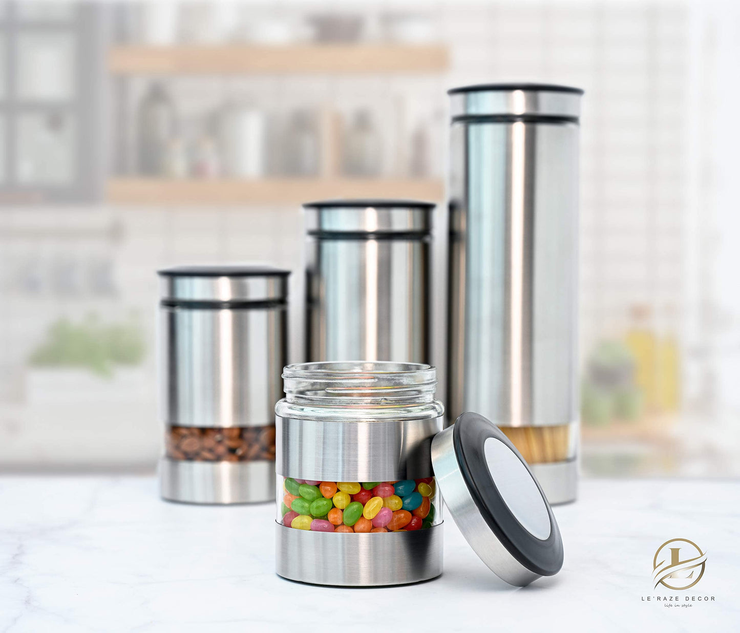 Le'raze Airtight Glass Canister Set of 4 with Stainless Steel Sleeve for Kitchen Counter - Food Storage Containers with Glass Window and Airtight Lids - Pantry Storage and Organization Set