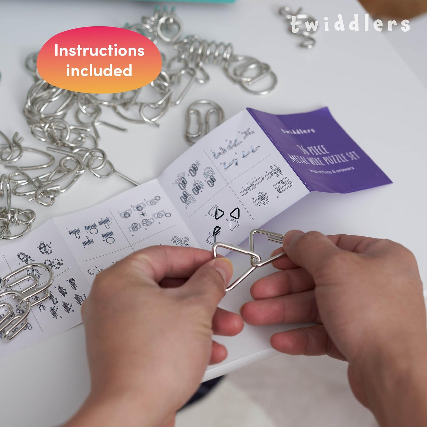 THE TWIDDLERS 36 Pieces Metal Wire IQ Brain Teaser Mind Puzzles, Multipack Mini School Gift Toys, Party Bag Fillers for Kids & Adults Party Favours, Instructions Included