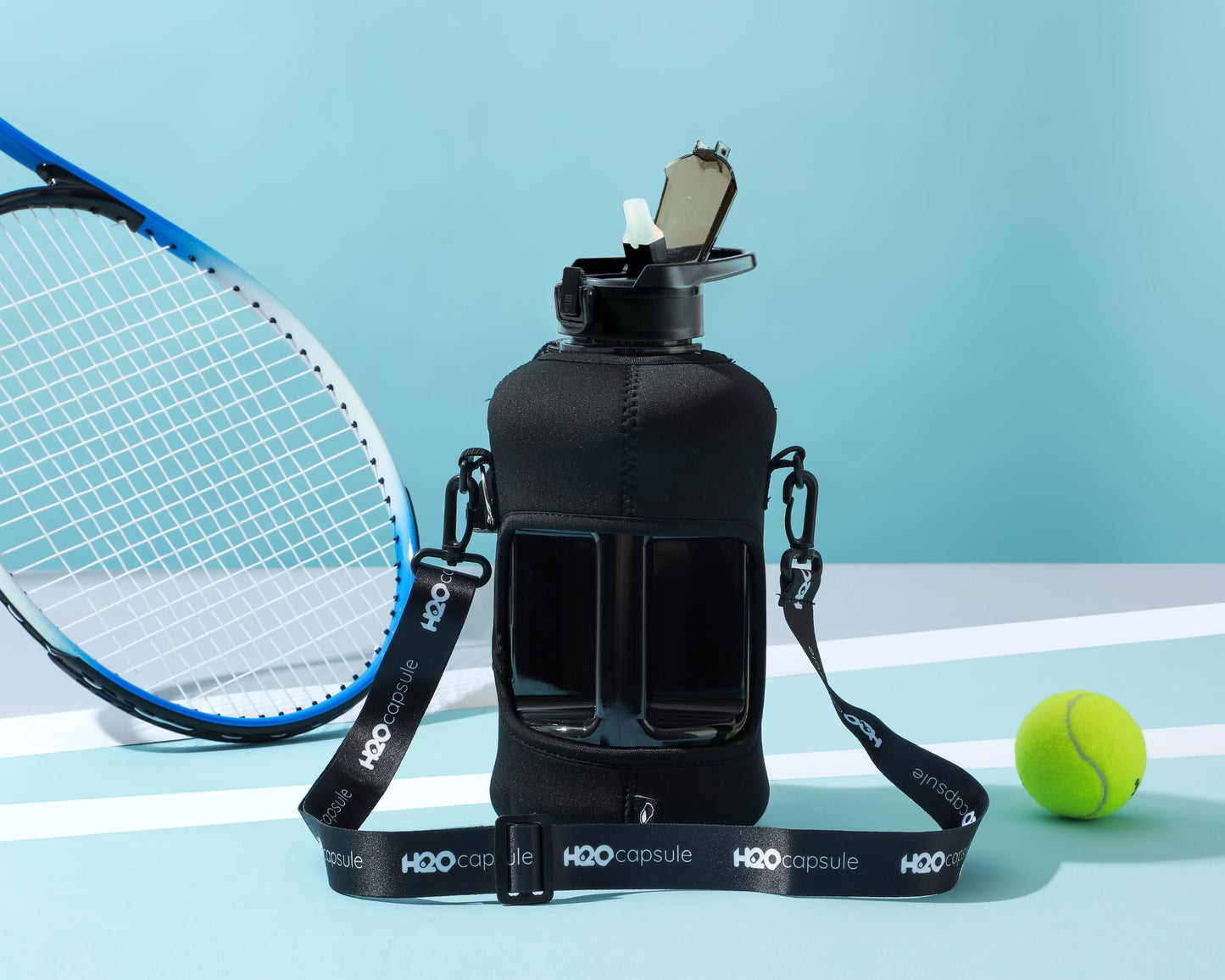 H2O Capsule 2.2L Half Gallon Water Bottle with Storage Sleeve and Removable Straw – BPA Free Large Reusable Drink Container with Handle - Big Sports Jug, 2.2 Liter (74 Ounce), Jet Black