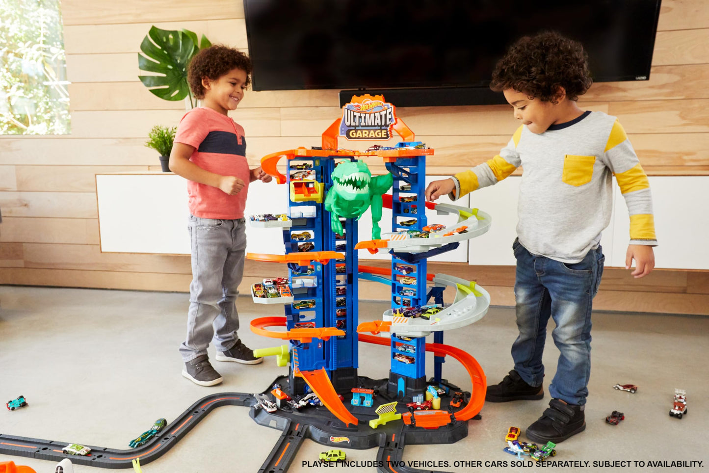 Hot Wheels City Ultimate Garage Playset with Multi-Level Racetrack, 91 cm Tall Moving T-Rex Dinosaur, Parks 100 Cars, Includes 2 Toy Cars, Toys for Ages 5 to 8, One Pack, GJL14