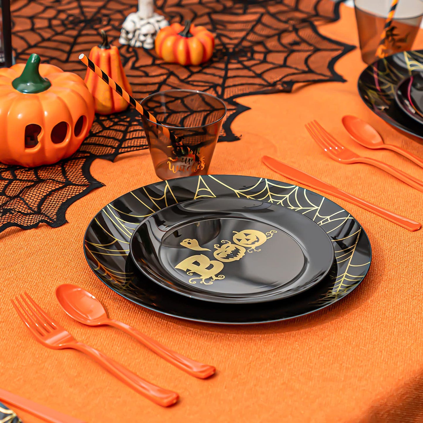 ISFANGCO 150PCS Plastic Spoof Black Dinnerware Set for 25 Guests with Gold Spider Web & Smiley Pumpkin,Heavy Duty Plastic Orange Disposable Cutlery,Gold Witch Printed Black Cups