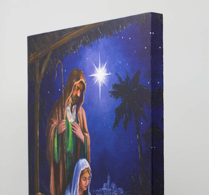 Nativity Lighted Canvas Wall Art - Light Up Holy Family Picture - LED - Mary Joseph and Baby Jesus in a Manger -Stable Scene - Measures 15.75" x 11.75"
