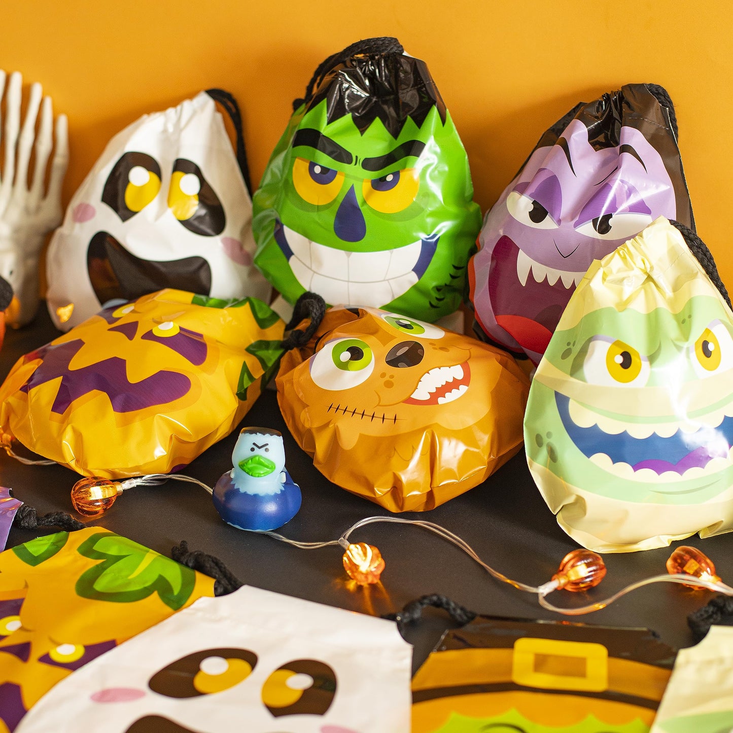 JOYIN 60PCS Halloween Drawstring Treat Bags, Trick or Treating Goodie Candy Small Plastic Gifts Bags Bulk in 12 Cute Monster Designs, Kids Halloween Party Favors Supplies