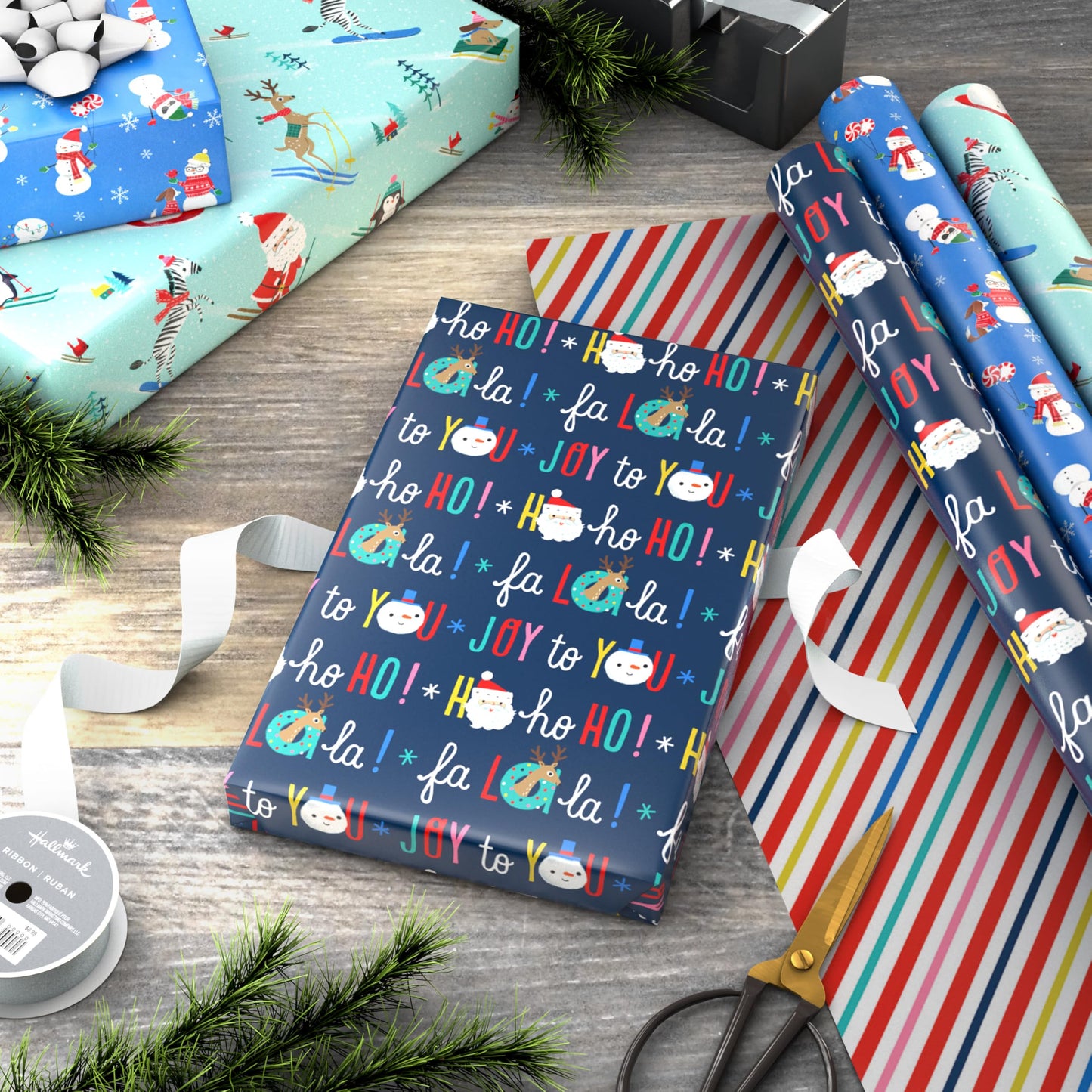 Hallmark Reversible Christmas Wrapping Paper for Kids (3 Rolls: 120 Sq. Ft. Total) Snowmen, Stripes, Trees, Skiing Santa, Zebras, Hedgehogs, Penguins